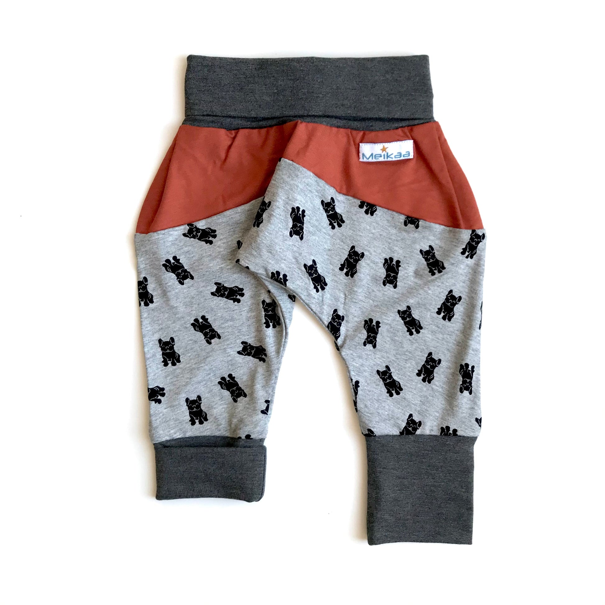 Kids grow-with-me harem pants with dog print, rust orange waistband panel and gray cuffs