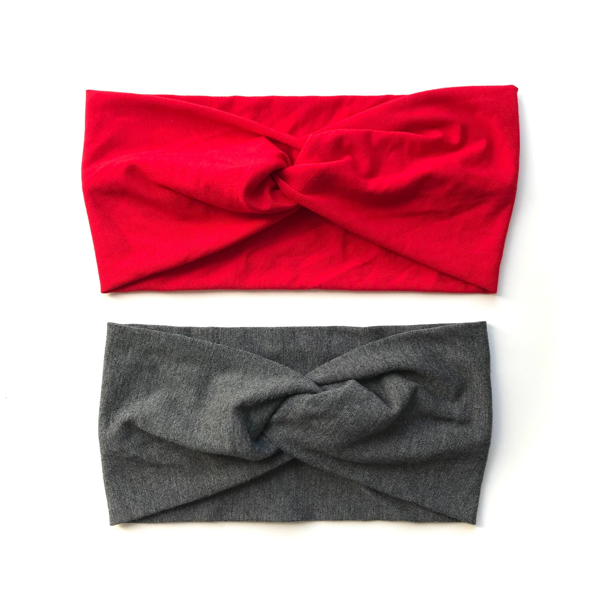 Set of twist headbands: bright red top and dark gray bottom.