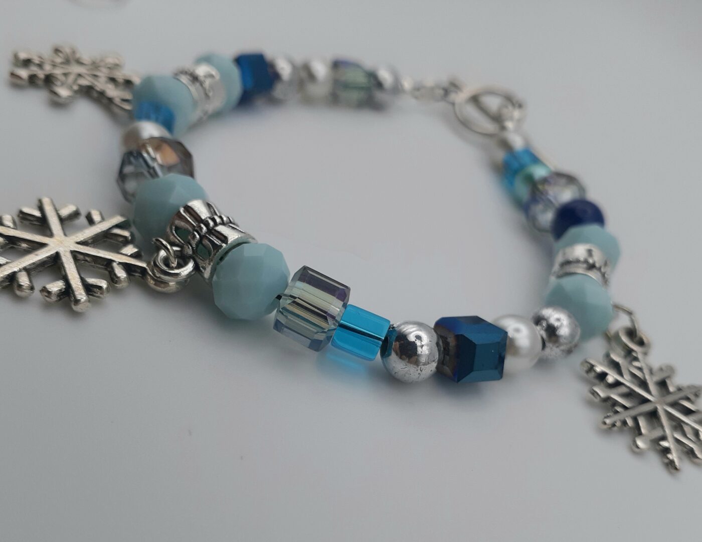 Blue Ice Bracelet Various Shades of Blue Crystal Cubes Faceted Czech Beads and 3D Tibetan Silver Snowflake Charms