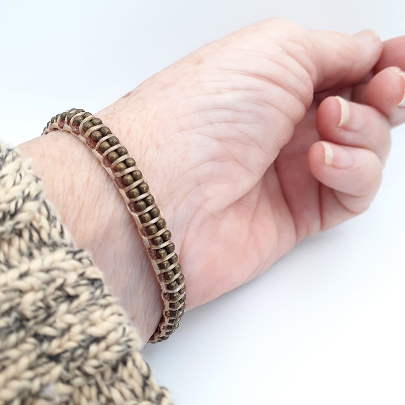 Brown suede leather bracelet with bronze ball chain and button closure