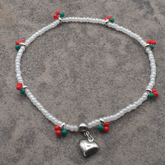 Cherry Love Stretch Anklet White Seed Beads with Little Red and Green Fruity Accents of Colourful Beads and a Puffy Silver Heart Charm