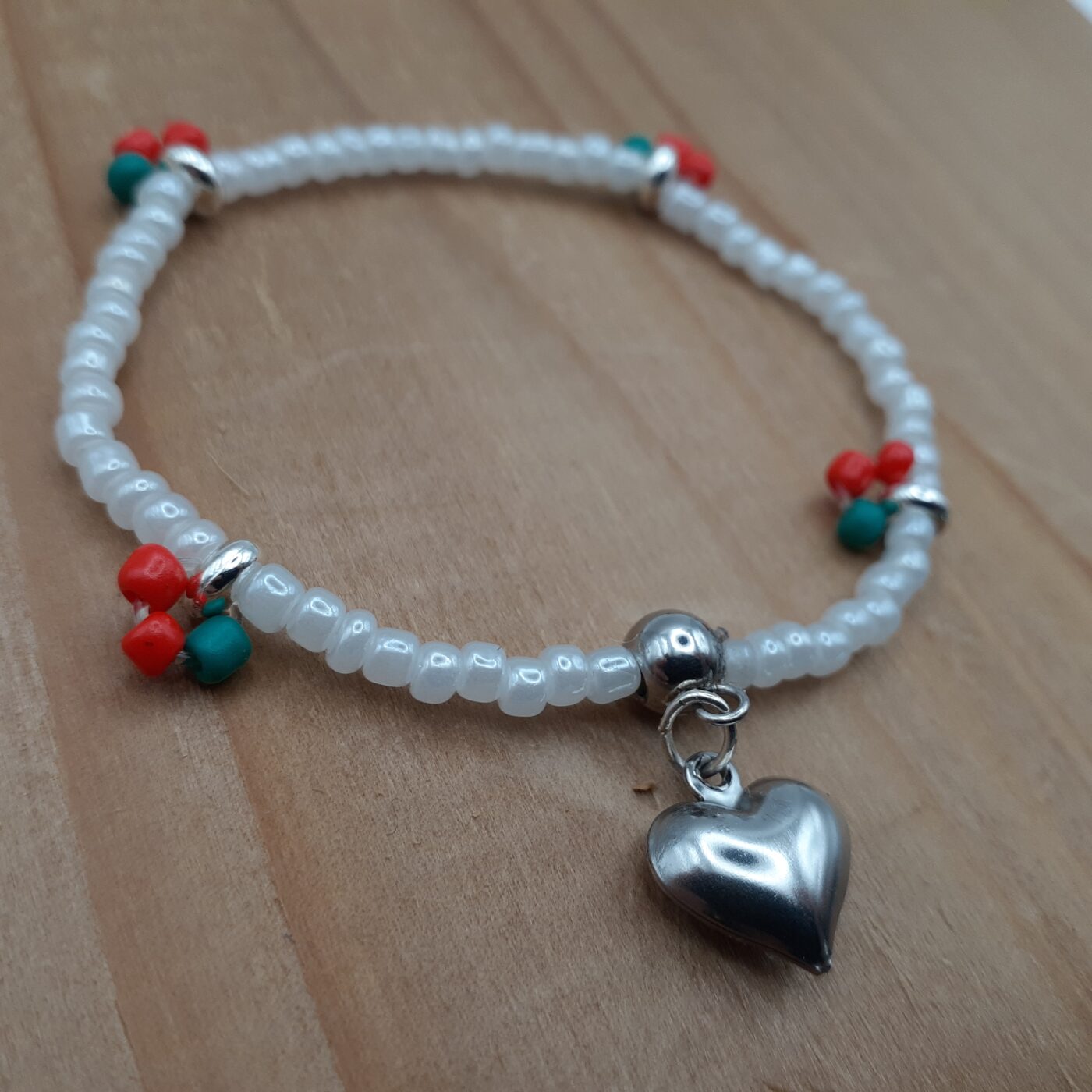 Cherry Love Stretch Bracelet White Seed Beads with Little Red and Green Fruity Accents of Colourful Beads and a Puffy Silver Heart Charm