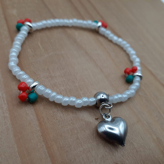 Cherry Love Stretch Bracelet White Seed Beads with Little Red and Green Fruity Accents of Colourful Beads and a Puffy Silver Heart Charm