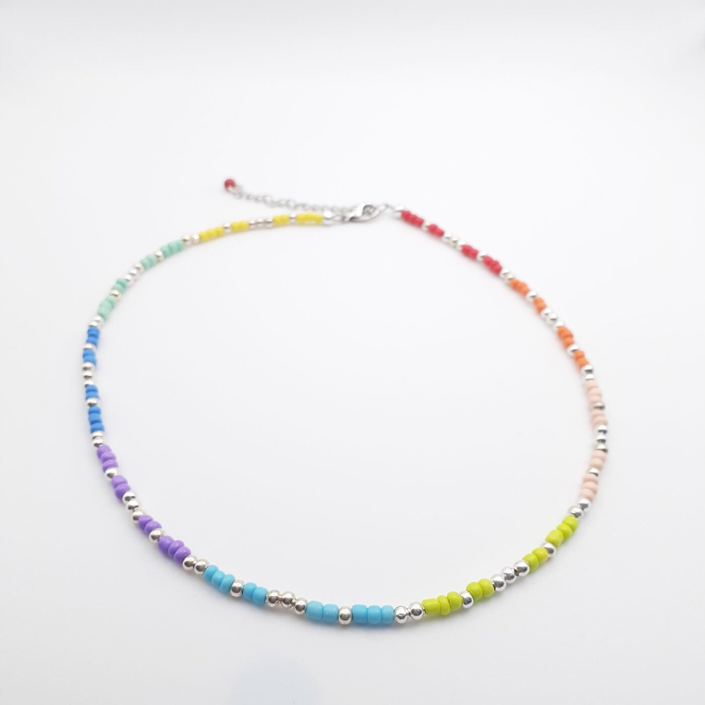 Colourful Short Seed Bead Necklace in Bands of Brilliant Colours and Silver Spacer Beads