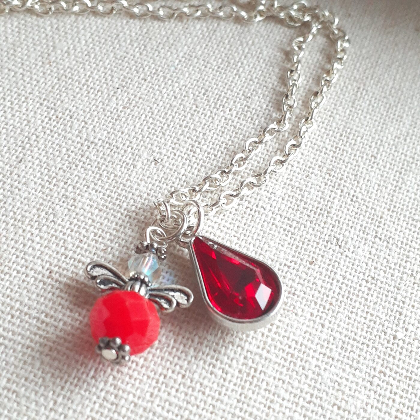 Faceted Opaque Red Czech Crystal and Swarovski Crystal Tiny Guardian Angel Charm with a Red Crystal Teardrop Charm on a Sterling Silver Thin Chain Necklace