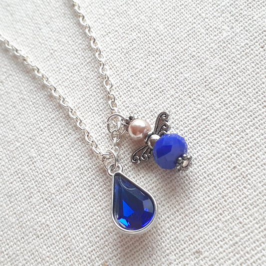 Faceted Opaque Sapphire Blue Czech Crystal and Pearl Guardian Angel Charm with a Blue Crystal Teardrop Charm on a Sterling Silver Thin Chain Necklace