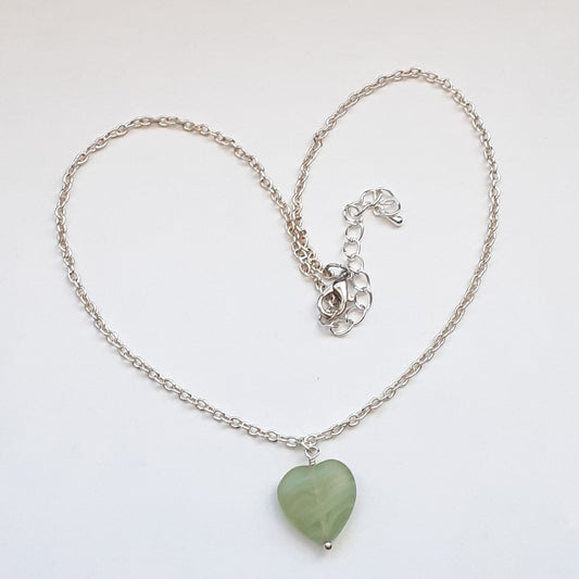 Green adventurine heart-shaped stone pendant on a sterling silver chain necklace