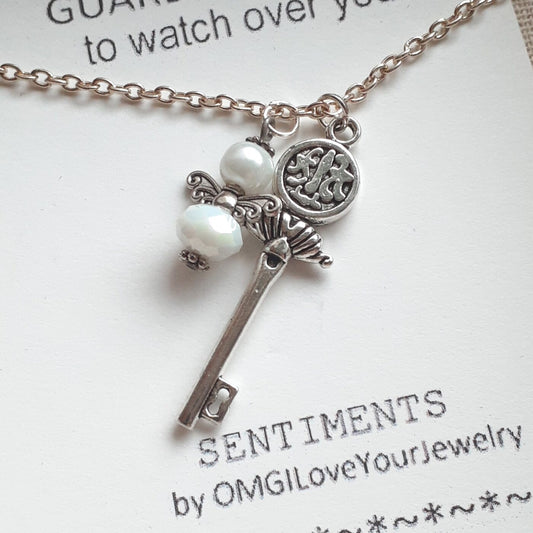 Opaque White Faceted Czech Crystal and Pearl Tiny Guardian Angel Charm and Tibetan Silver 3D Key Charm on a Sterling Silver Necklace Chain