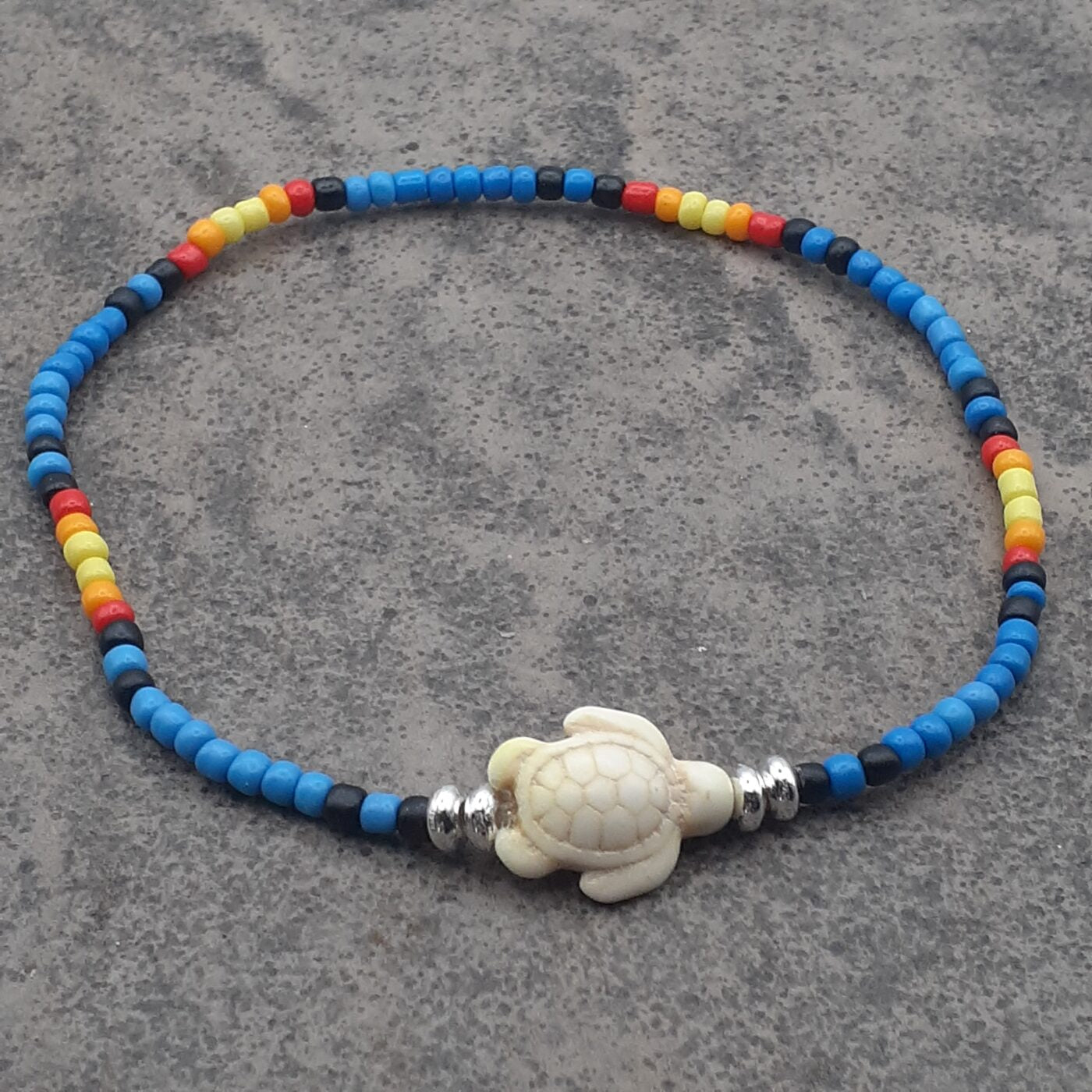 Seaturtle Sensation Colourful Seed Bead Anklet in Bands of Blues, Sunny Yellows, Reds, and Black