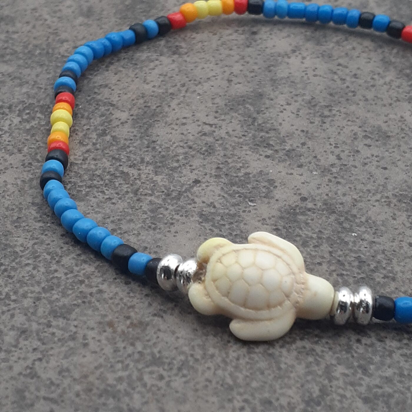Seaturtle Sensation Colourful Seed Bead Anklet in Bands of Blues, Sunny Yellows, Reds, and Black