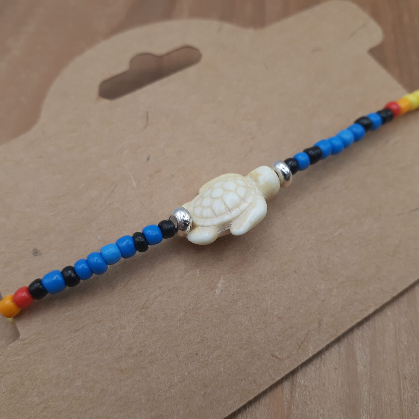 Seaturtle Sensation Colourful Seed Bead Bracelet in Bands of Blues, Sunny Yellows, Reds, and Black