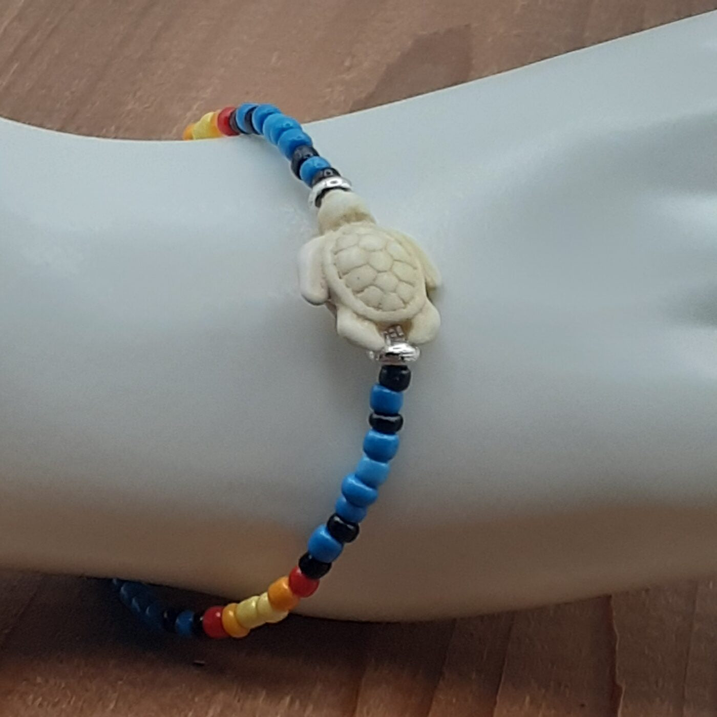 Seaturtle Sensation Colourful Seed Bead Bracelet in Bands of Blues, Sunny Yellows, Reds, and Black