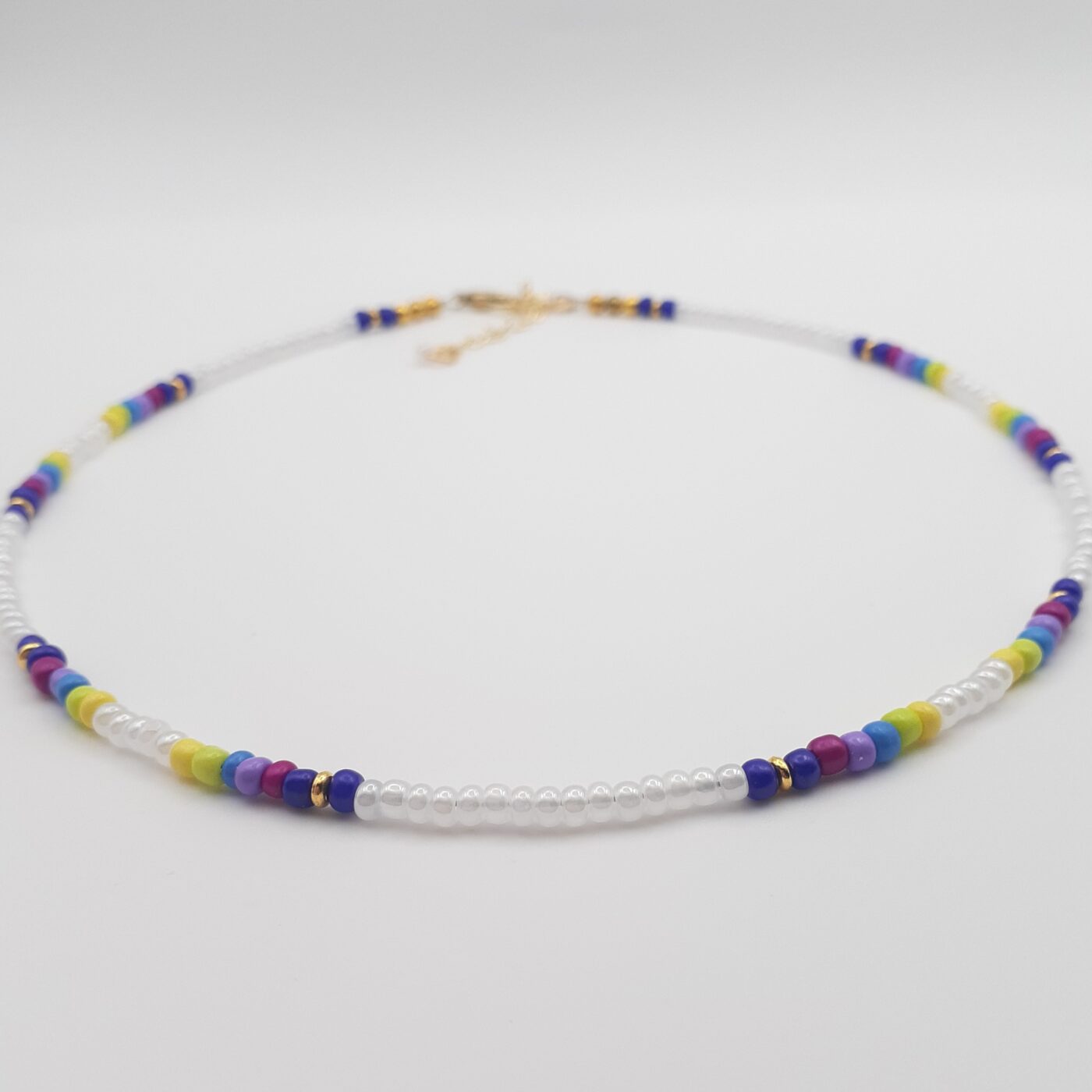 Short White Seed Bead Necklace with Splashes of Vibrant Colour Bands