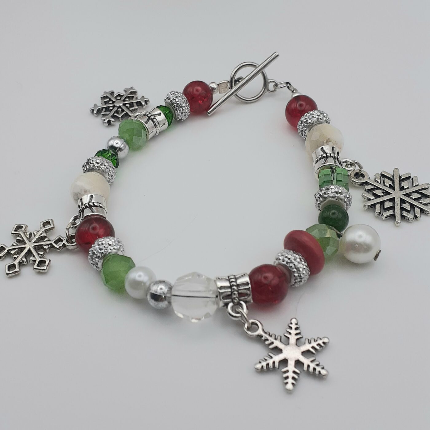 Snowflake Fantasy Bracelet in Red and Green Beads and White Pearls with Tibetan Silver 3D Snowflake Charms