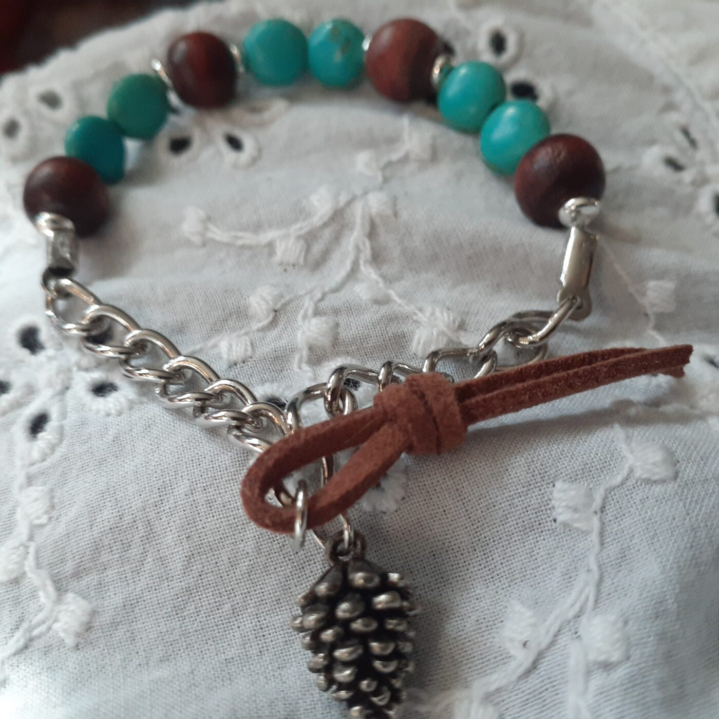 Turquoise Howlite and Natural Wood Beaded Stretch-Style Bracelet with Silver Chain and Tiny Detailed Pinecone Dangling Charm