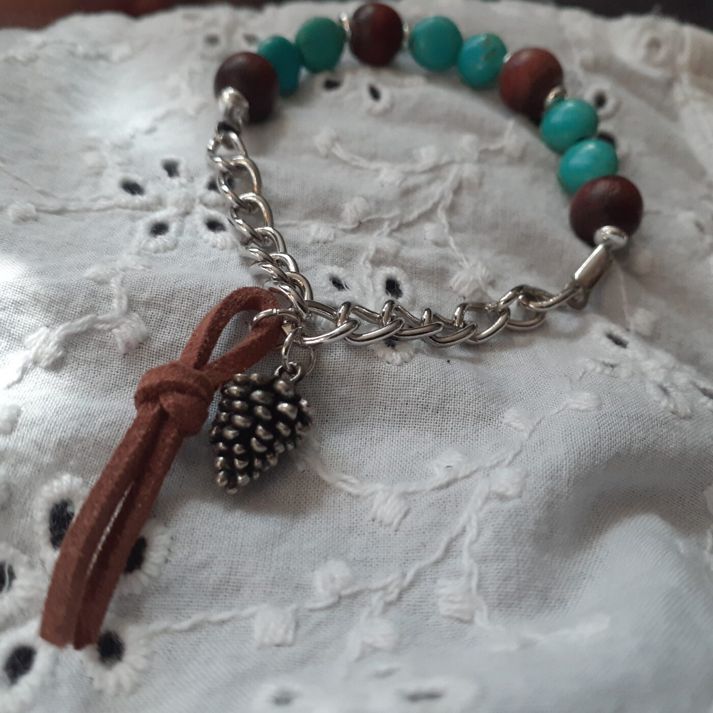 Turquoise Howlite and Natural Wood Beaded Stretch-Style Bracelet with Silver Chain and Tiny Detailed Pinecone Dangling Charm