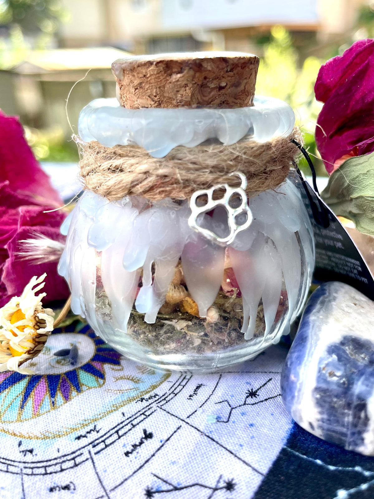 Glass pet spell jar with cork, twine wrap, and paw-print charm