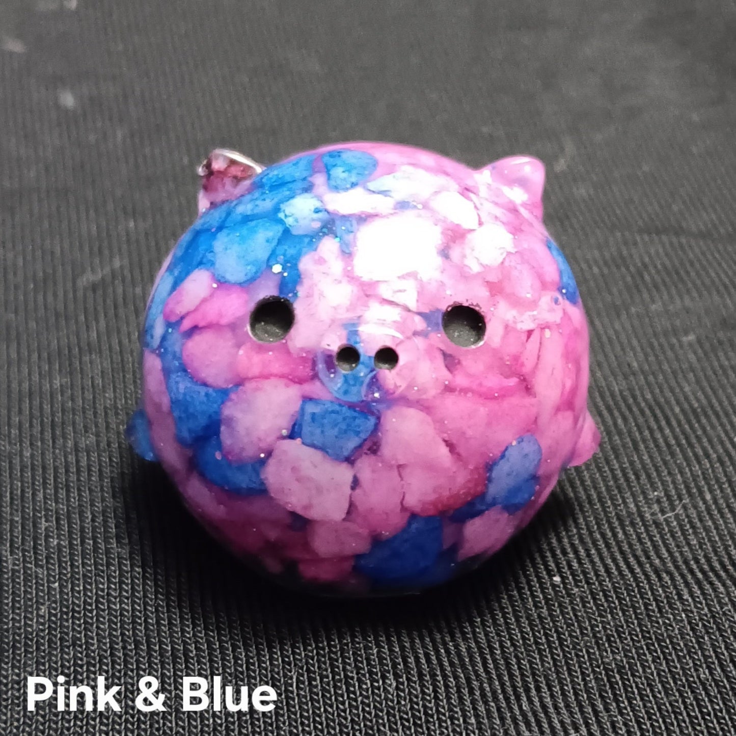 Pink and blue mini pig plush with speckled pattern, round ears, and snout holes.