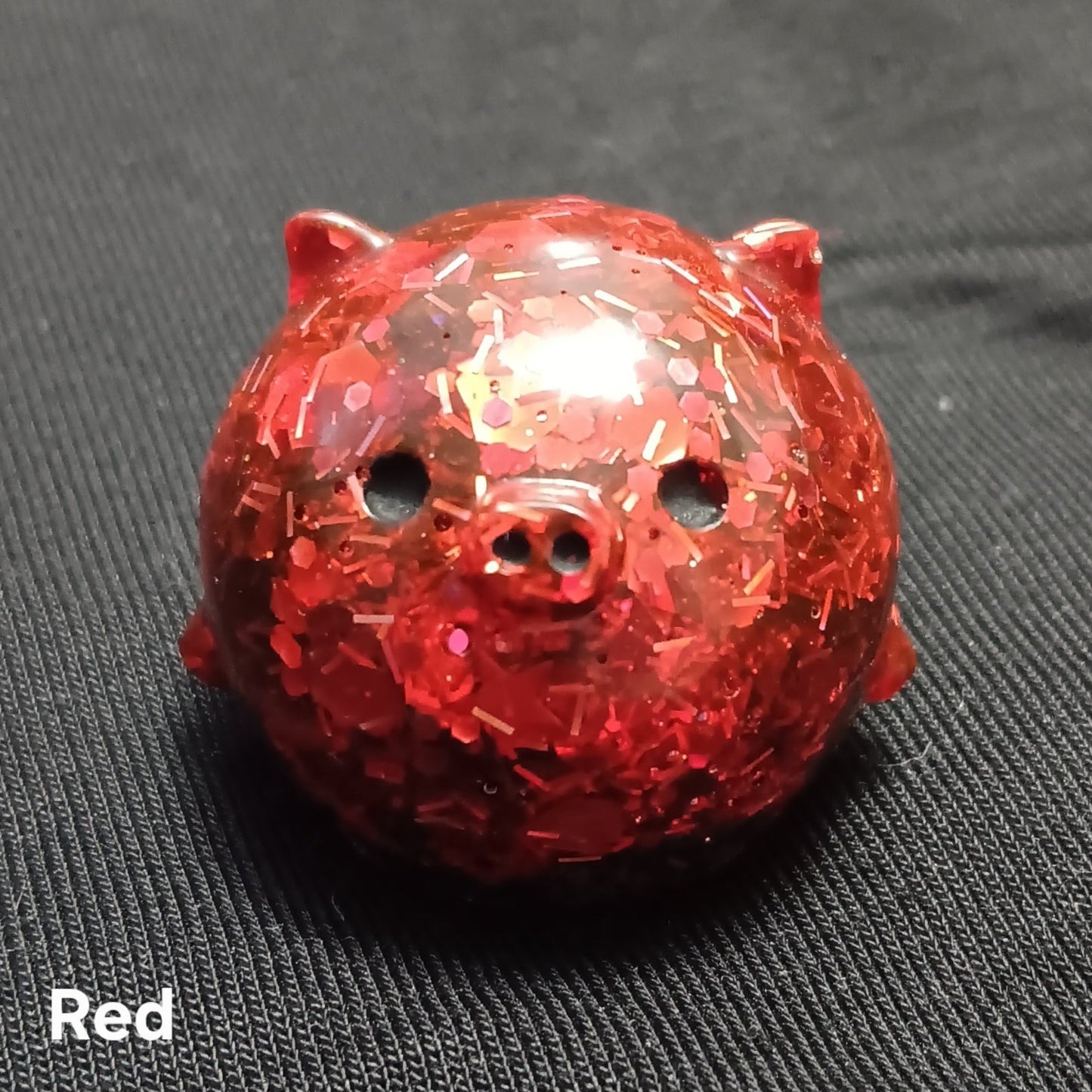 Red glitter mini pig plush with sparkly texture, round ears, and snout holes.