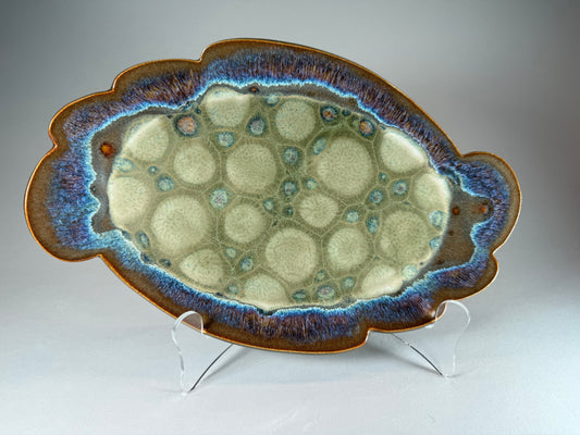 Glacier Bloom decorative ceramic tray with scalloped edge, blue rim, green textured center