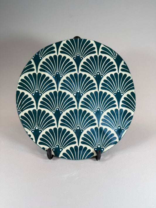 Decorative plate with art deco fan pattern in teal and cream