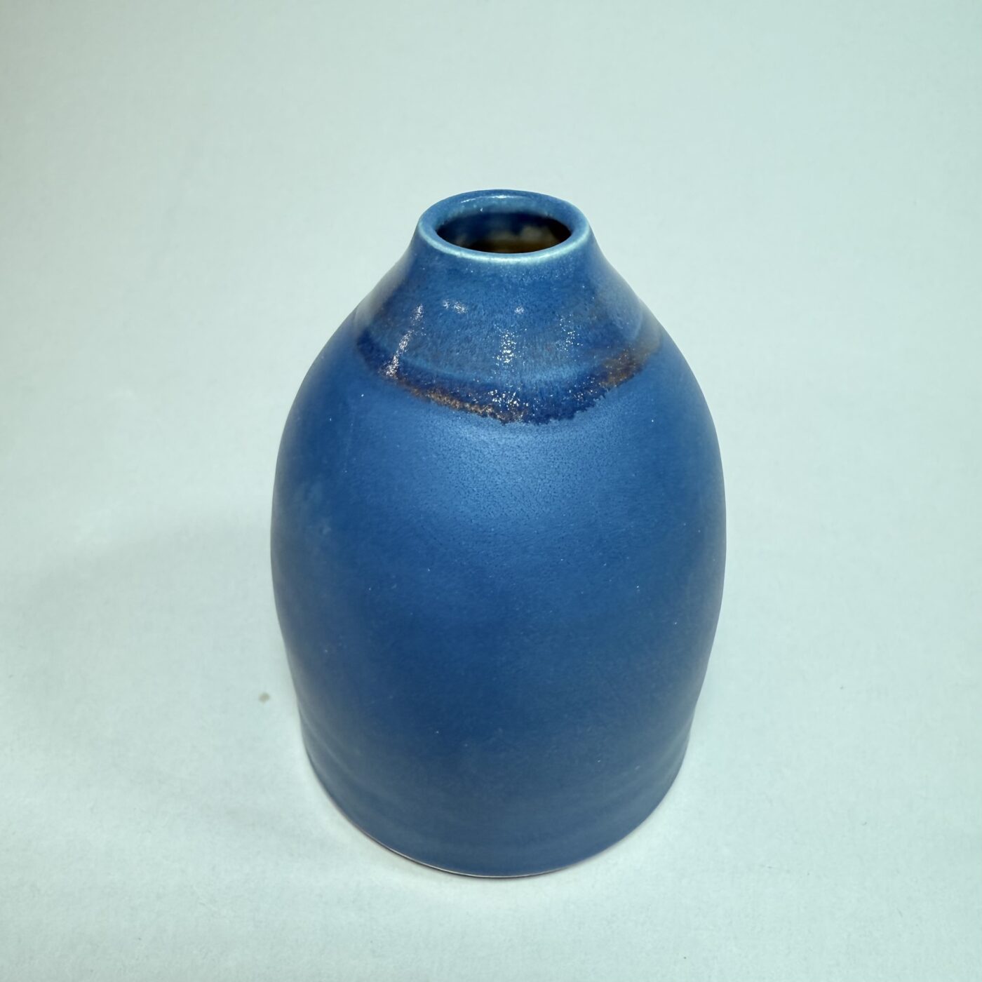 French blue ceramic bud vase with narrow neck and rounded body