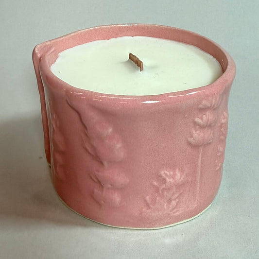 Erie Shores candle in pink embossed ceramic with white wax top and wooden wick