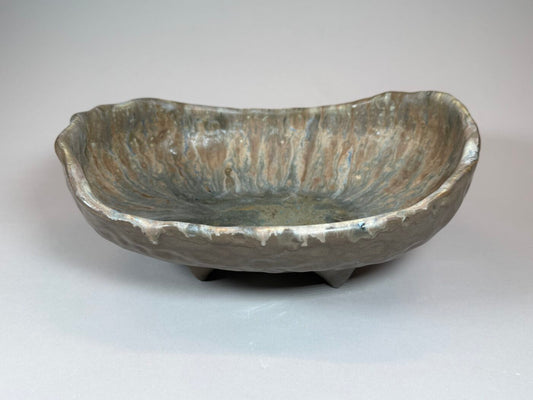 Rustic glazed ceramic serving bowl, oval shape, mottled gray-green finish