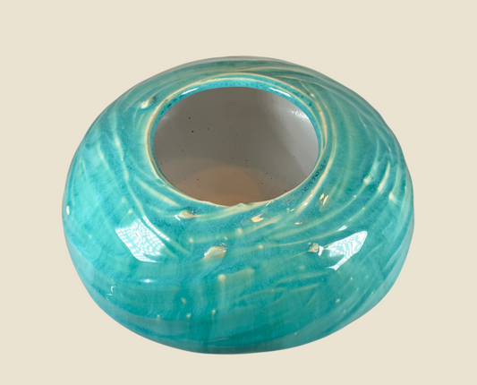 Artisan crackle vase in teal with rounded top opening and glossy swirl texture