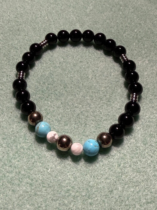 Stainless Steel, Onyx, Hematite, and Howlite Skulls Bracelet