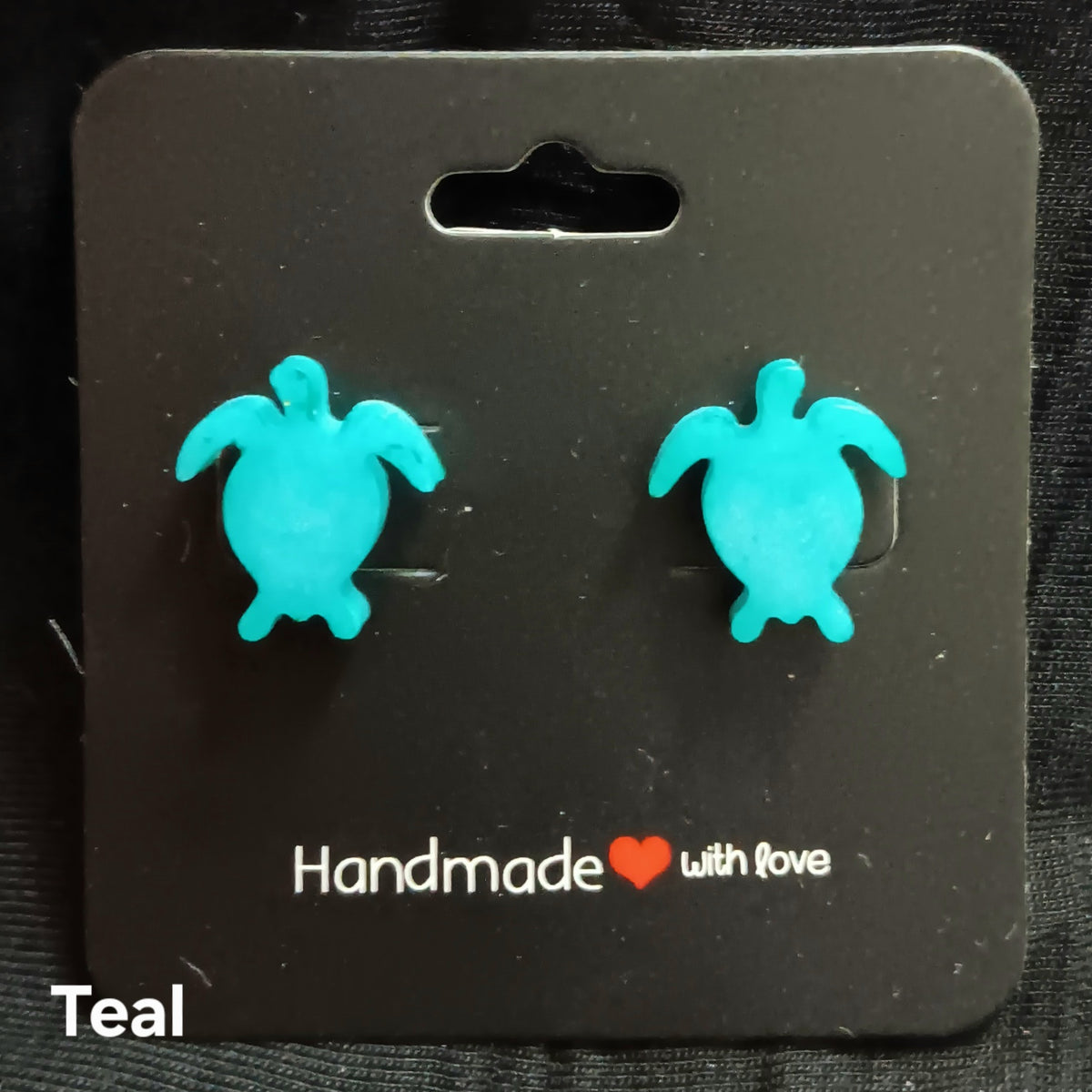 Teal turtle stud earrings with glossy resin turtle shapes, stud backs