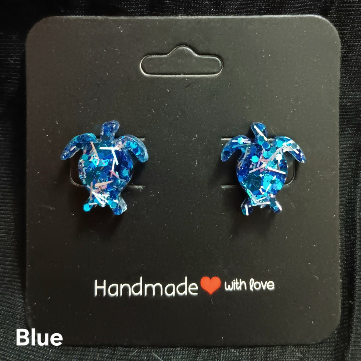 Blue turtle stud earrings with glittery resin turtle shapes, stud backs