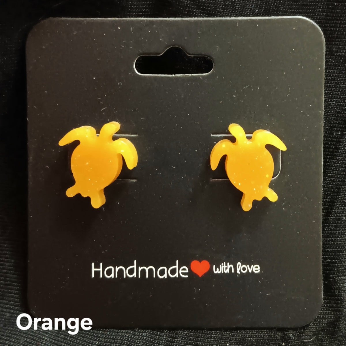 Orange turtle stud earrings with glossy resin turtle shapes, stud backs