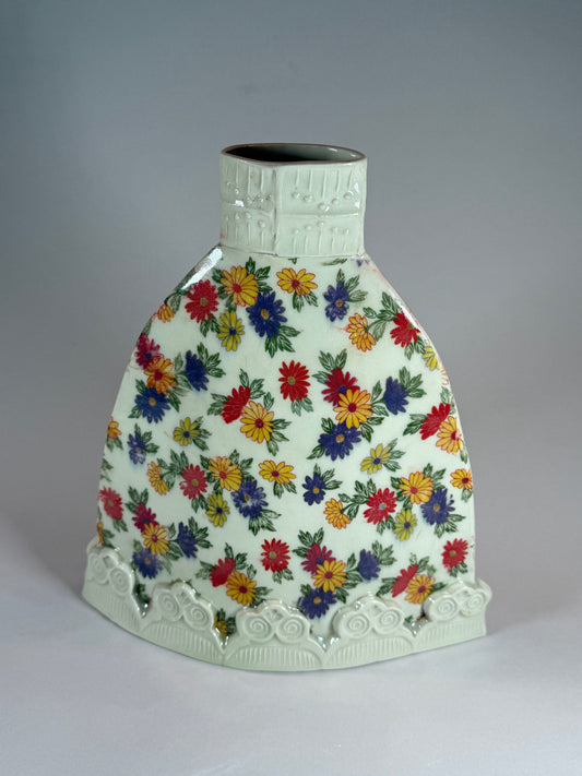 Flattie vase, white ceramic with colorful floral print and embossed scalloped base